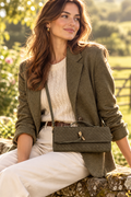Bag-focused lifestyle shot with soft countryside vibe